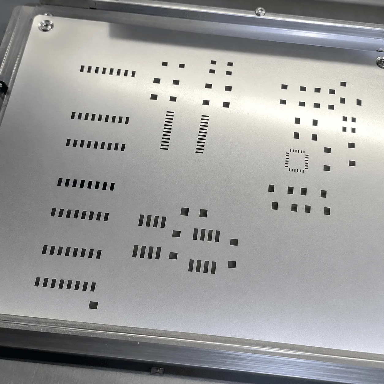 Precision laser cut stencil for SMT solder paste application